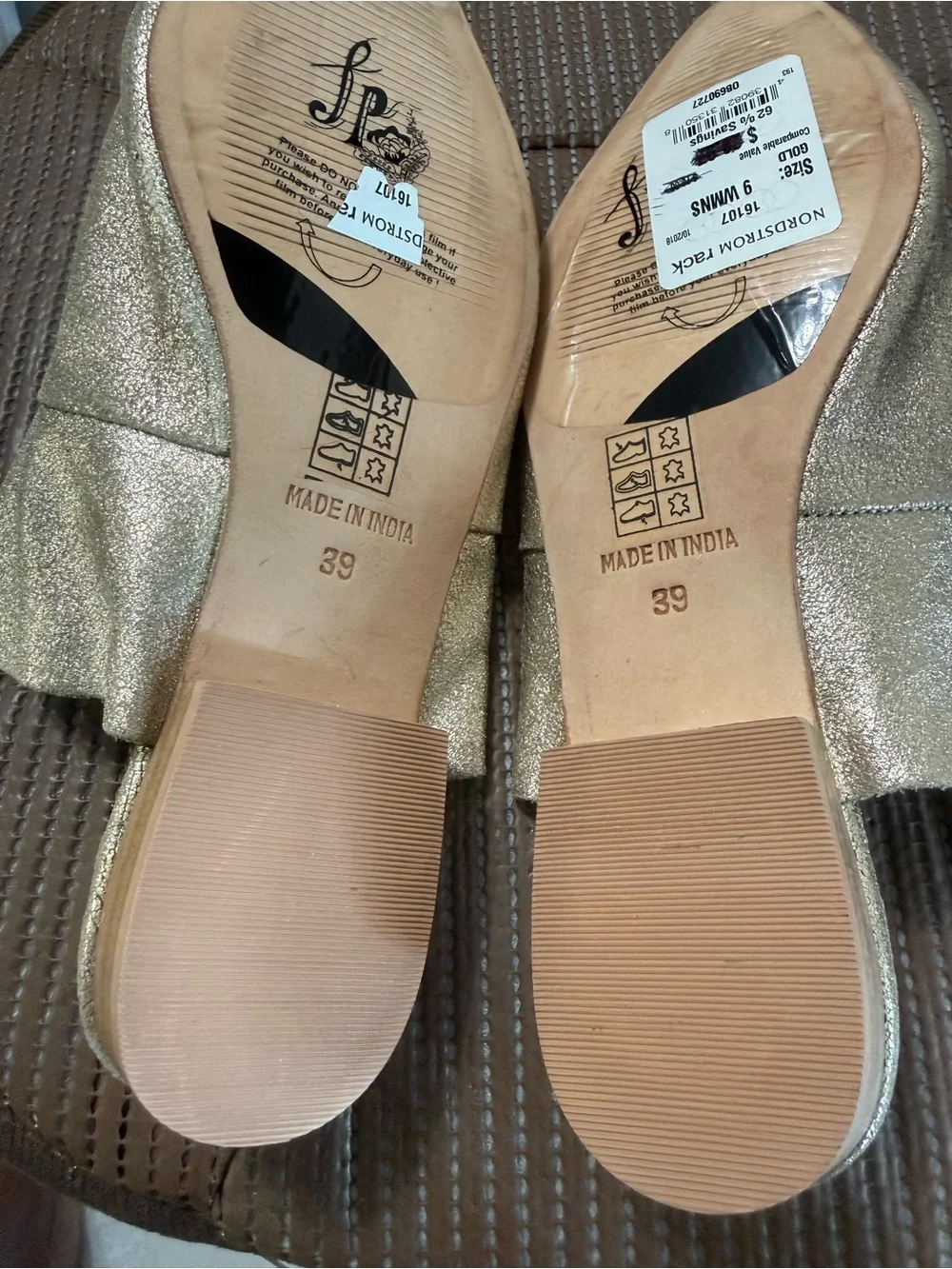 Free People metallic gold pointed-toe mule.